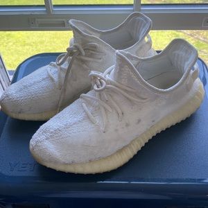 Cream/triple white Yeezy boost V2s.